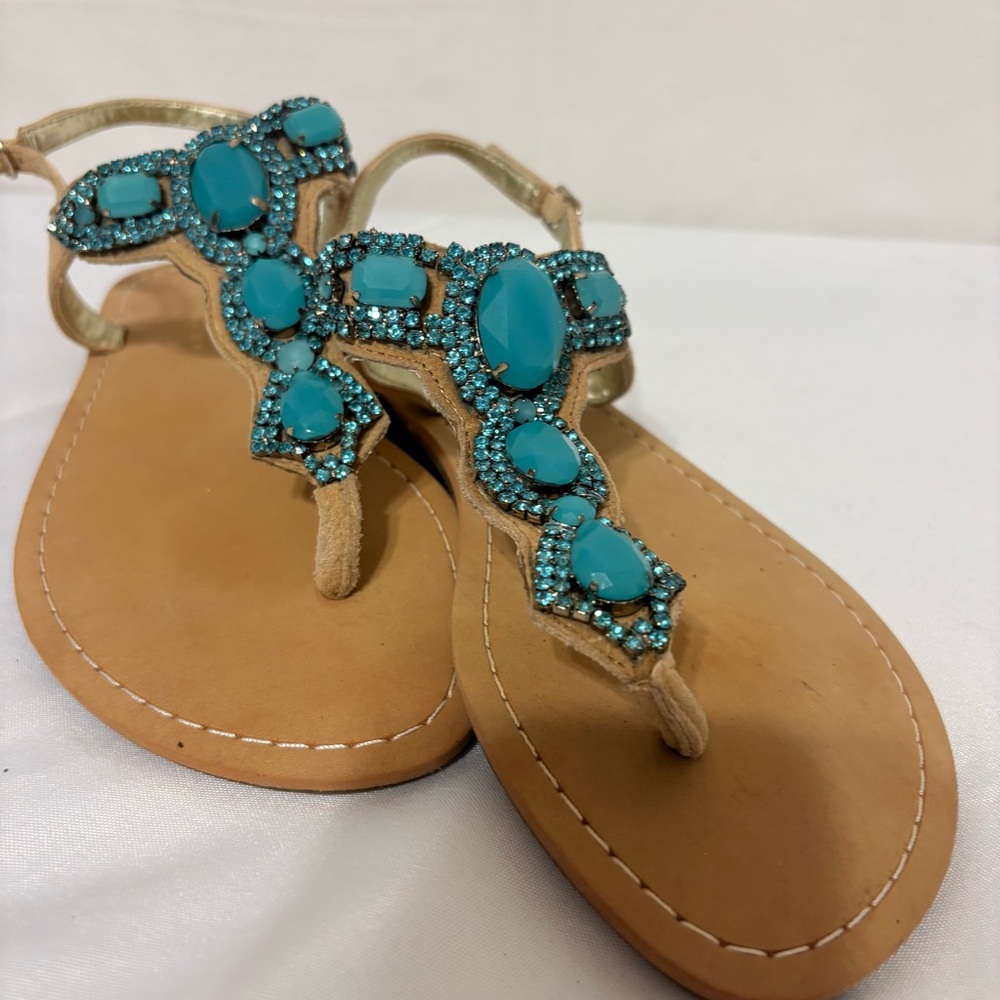 Cute summer sandals, featuring turquoise and rhinestone accents.